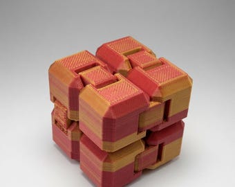 Infinity Cube Fidget Toy – Red Gold Gradient Desk Companion