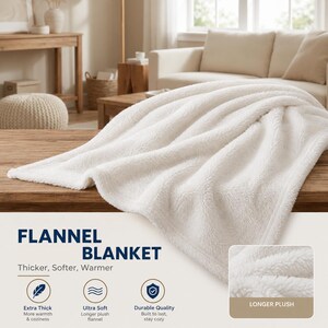 May include: A fluffy, off-white flannel blanket draped over a wooden surface. The blanket's texture is visible, with the words "FLANNEL BLANKET" and "Thicker, Softer, Warmer" in the image. Additional text includes "Extra Thick", "Ultra Soft", and "Durable Quality".