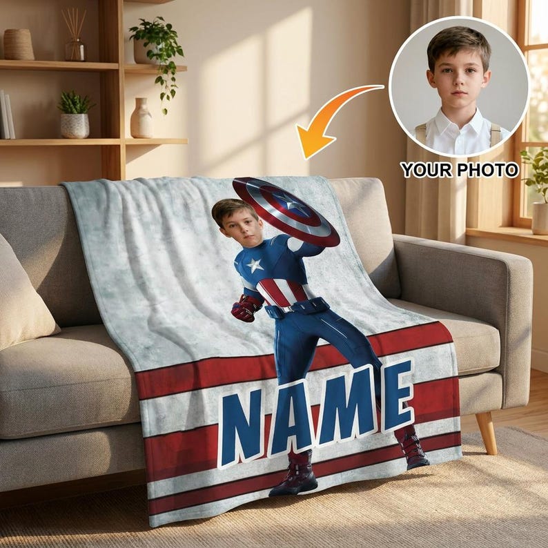 May include: A personalized Captain America blanket featuring a child in a superhero costume. The blanket has a red, white, and blue design with the word "NAME" in large blue letters. A photo of a child is in the upper right corner.