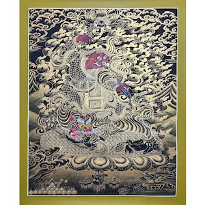 May include: A detailed painting featuring a central deity with a red face and ornate gold detailing. The artwork showcases a complex composition with a dragon-like figure, clouds, and a vibrant color palette of gold, black, and red. The painting is framed in a gold border.