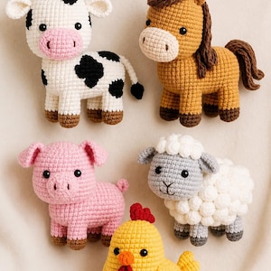 May include: A collection of five crocheted farm animal toys. Includes a white cow with black spots, a brown horse, a pink pig, a gray sheep, and a yellow chicken. Each toy has brown accents and black eyes.