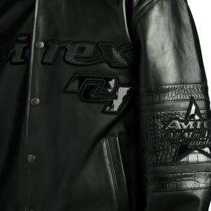 Handmade men’s aviator flight jacket featuring striped ribbed cuffs and welt pockets