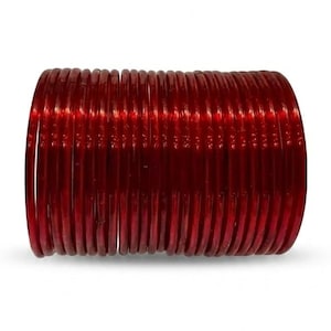 May include: A stack of numerous thin, circular bangles in a deep, translucent red colour. Each bangle features a smooth, rounded surface and a consistent, uniform diameter, creating a cylindrical shape when stacked together in a single group.