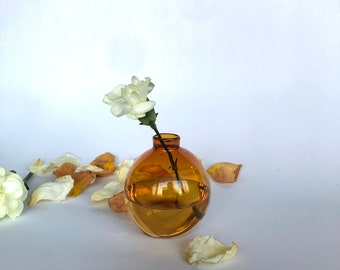 Small hand blown amber glass bud vase