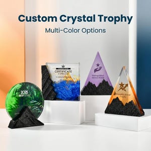 May include: A collection of custom crystal trophies in various shapes and colors. The trophies include a round green award, a rectangular certificate, and two triangular awards. The text on the trophies includes "2025 BEST", "CERTIFICATE OF APPRECIATION", and "Impactful Brand Trophy".