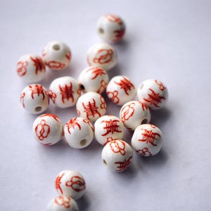 12mm Red and White Porcelain Peach and Longevity Beads