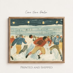 May include: A framed art print featuring a stylized illustration of a football game in progress. Players in red, blue, and white uniforms run across a field under a dark night sky with four glowing lights. The text Come Home Darlin is at the top.