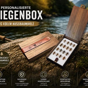 May include: A walnut wood fly fishing box, with the text "PERSONALISIERTE FLIEGENBOX" at the top. The box is open, displaying artificial flies. A leather strap with "Fly Stub" is visible. The box is on a natural stone surface. The box is made of natural walnut wood.
