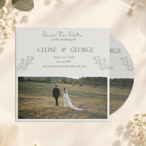 May include: A square Save the Date wedding card featuring the text Save The Date To The Wedding Of CELINE & GEORGE June 22 2028 At 3:00 PM 123 Anywhere St, Any City, ST, 123, with line art floral accents and a photograph of a couple in a field.