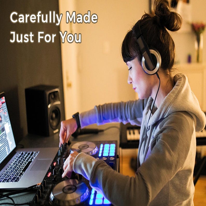 May include: A person wearing a grey hooded sweatshirt and black over-ear headphones, operating a black DJ controller with illuminated blue buttons and circular platters. A laptop and a black speaker are visible. Text reads: Carefully Made Just For You.