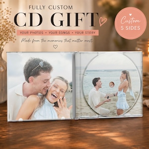 May include: A custom CD gift with photos, songs, and a story. The CD case is open, displaying photos of a couple. The CD itself features a photo of a proposal. Text on the case reads "FULLY CUSTOM CD GIFT".