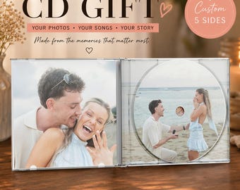 May include: A custom CD gift case featuring a photo of a couple on the left panel and a photo of a marriage proposal on the disc. Text on the case reads FULLY CUSTOM CD GIFT, YOUR PHOTOS, YOUR SONGS, YOUR STORY, and Custom 5 SIDES.