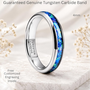 May include: A 4mm tungsten carbide band featuring a polished silver-tone finish and a central inlay of vibrant blue and green crushed opal. The interior of the ring is clearly stamped with the text TUNGSTEN CARBIDE.