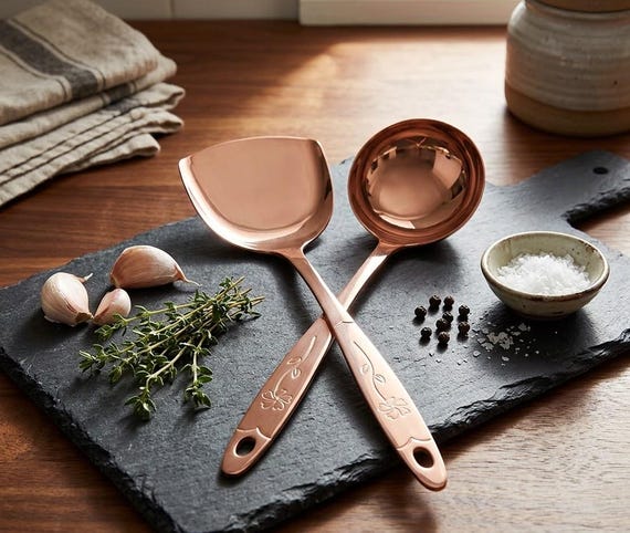 Genuinely handcrafted pure copper ladle and spatula set with that warm, burnished patina you can't fake — the kind of kitchen heirloom that gets passed down, not tossed out.