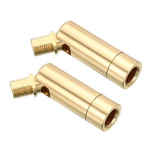 May include: Two gold-colored metal swivel connectors featuring a threaded male end on one side and a cylindrical body with an internal threaded female opening on the other. These components have a polished finish and a hinged joint mechanism.