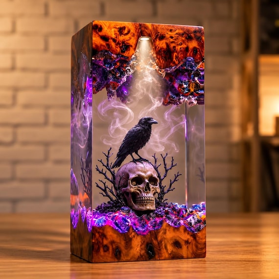 A handcrafted raven frozen mid-pose inside glowing epoxy resin — equal parts Gothic diorama, night light, and dark academia conversation piece.