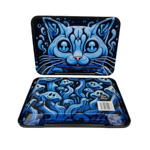 May include: Two rectangular trays with black edges. The top tray displays a blue cat face design. The bottom tray has a blue mushroom design with the text "Wise Skies" and a barcode. Both trays are on a white background.