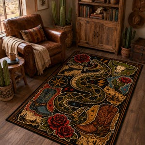 May include: A rectangular area rug featuring a black background with a large central rattlesnake, two cowboy boots, red roses, a steer skull, a pistol, a compass star, and desert cactus motifs in shades of brown, blue, red, and green.