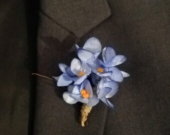 Handmade lapel pins for wedding and graduation outfits.