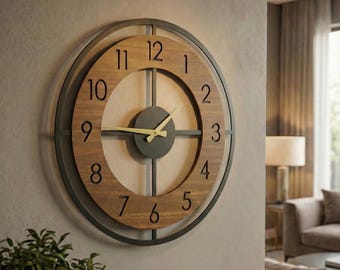 May include: A large circular wall clock featuring a dark metal outer frame and a central wooden dial with black Arabic numerals. The clock has a dark circular centre piece and thin gold-coloured hour and minute hands, mounted on a light-coloured wall.