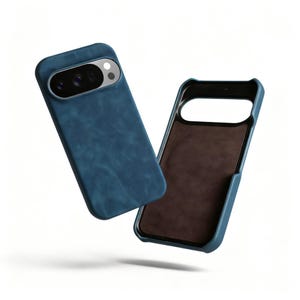 May include: Two blue phone cases. One case is shown with the camera lens exposed, and the other case is shown with a brown interior. The cases are made of a textured material.