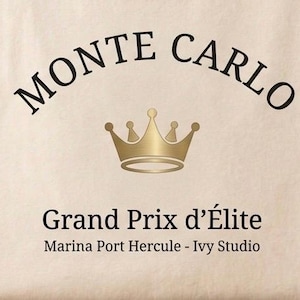 May include: A beige background with the words "MONTE CARLO" arched across the top in black. Below, a gold crown is centered, and beneath it, the text "Grand Prix d'&Eacute;lite" is displayed. The text "Marina Port Hercule - Ivy Studio" is at the bottom.