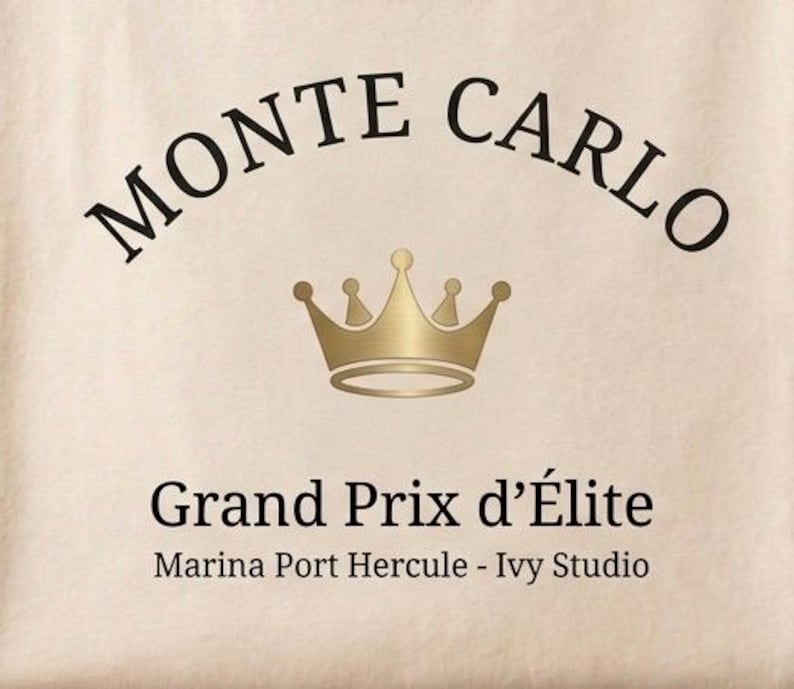 May include: A beige background with the words "MONTE CARLO" arched across the top in black. Below, a gold crown is centered, and beneath it, the text "Grand Prix d'&Eacute;lite" is displayed. The text "Marina Port Hercule - Ivy Studio" is at the bottom.
