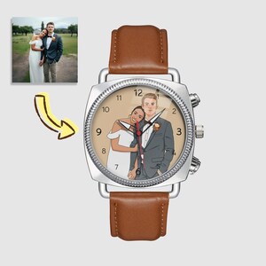May include: A silver wristwatch with a brown leather strap. The watch face displays a custom illustration of a couple in wedding attire. A small photo of the couple is in the upper left corner, with a yellow arrow pointing to the watch.