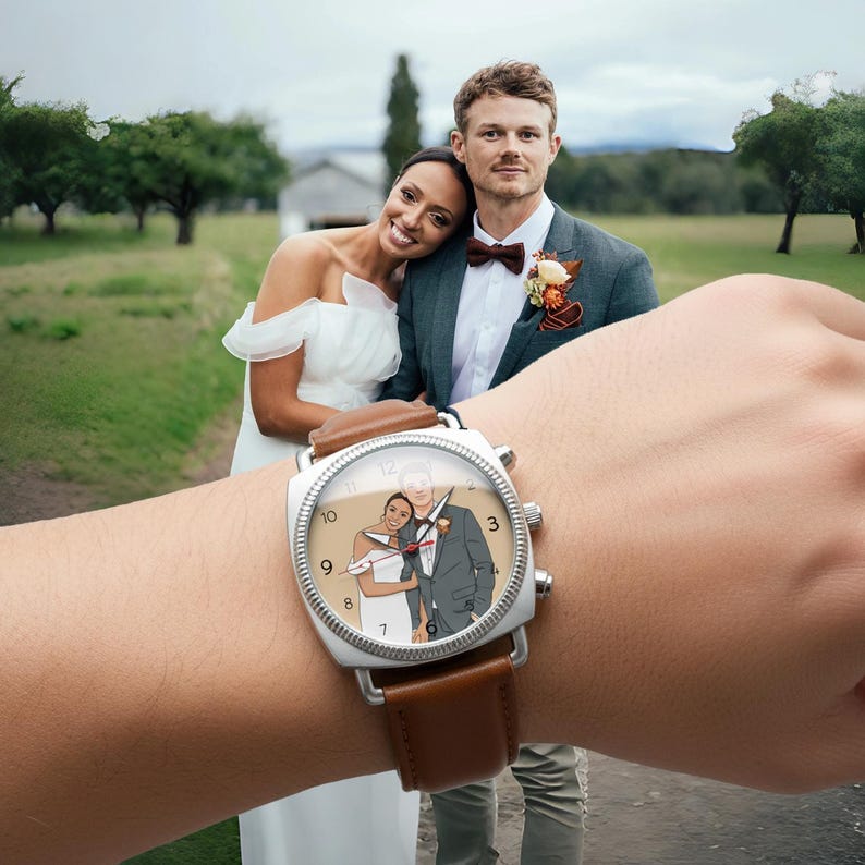 May include: A square-faced wristwatch with a brown leather strap. The watch face displays a couple in wedding attire. The watch is on a wrist, with a blurred background of a couple in wedding attire.