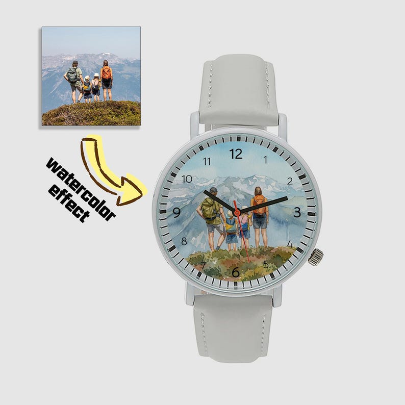 May include: White wristwatch with a watercolor-style image of a family hiking in the mountains on the watch face. The watch has a white leather strap and a silver-colored case. The image includes the text "watercolor effect".