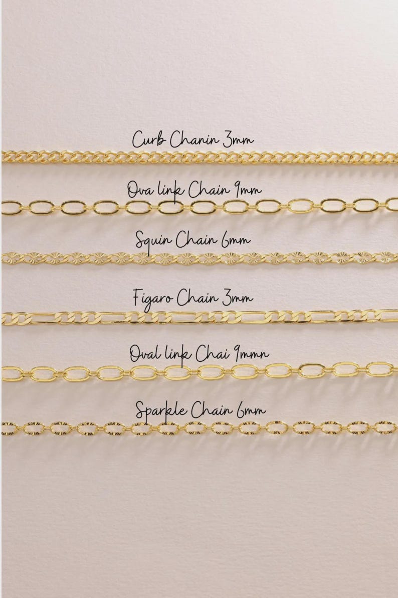 May include: A collection of gold-colored chain necklaces in various styles, including curb, oval link, and figaro chains. Each chain is labeled with its style and width in millimeters. The chains are displayed against a light background.