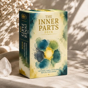 May include: A rectangular box for The Inner Parts Deck, featuring a watercolour design in shades of blue, green, and yellow. The front and side display the title, the text Internal Family Systems Reflection Cards, and the count of 48 cards.