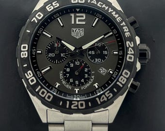Reloj de pulsera vintage TAG Heuer Formula 1 Cronógrafo de cuarzo con esfera gris y fecha para hombre, en perfecto estado de funcionamiento.