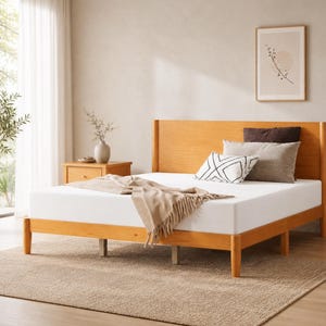 May include: A wooden bed frame with a light-colored mattress. The headboard and frame are made of light-colored wood. The bed is made up with pillows and a blanket. The bed is in a well-lit room with a neutral color scheme.