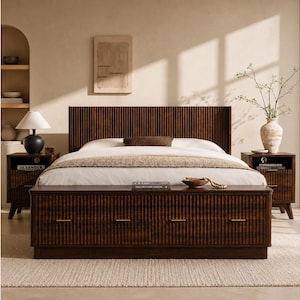 May include: A dark brown wooden bed frame with a vertically slatted headboard and footboard. The bed has a white comforter and pillows. Two matching nightstands flank the bed, each with a lamp and drawer.