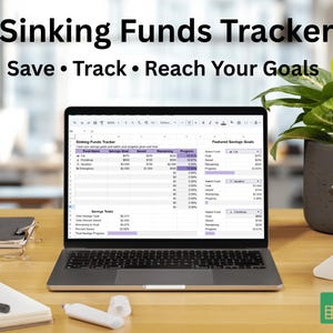 May include: A laptop displaying a spreadsheet titled "Sinking Funds Tracker" with the text "Save • Track • Reach Your Goals." The laptop is on a wooden desk, with a notebook, pen, and plant in the background. A green Google Sheets icon is visible.
