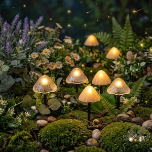 May include: A cluster of illuminated mushroom-shaped garden lights. The lights have textured, translucent caps and emit a warm, inviting glow. They are set amidst lush greenery, moss, and small stones, creating a whimsical, fairy-tale ambiance for outdoor decor.