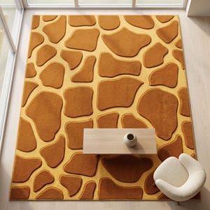 May include: A rectangular area rug featuring a repeating giraffe-inspired pattern of irregular, raised brown patches set against a flat, light yellow background. The rug has a textured surface with distinct depth between the shapes.