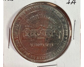 Casino Hipódromo Prairie Meadows, Altoona, Iowa. Moneda de ficha de juego de un dólar.