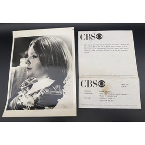 May include: A black and white promotional photograph of Diane Keaton alongside two CBS press release sheets. The text includes details about the film Play It Again, Sam, the CBS Tuesday Night Movies, and the air date of Tuesday, June 13.