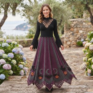 May include: A long-sleeved black crochet dress featuring a spiderweb-patterned neckline and a flared skirt. The skirt alternates between deep purple and dark gray panels, decorated with crocheted motifs of black bats, crescent moons, and orange pumpkins.