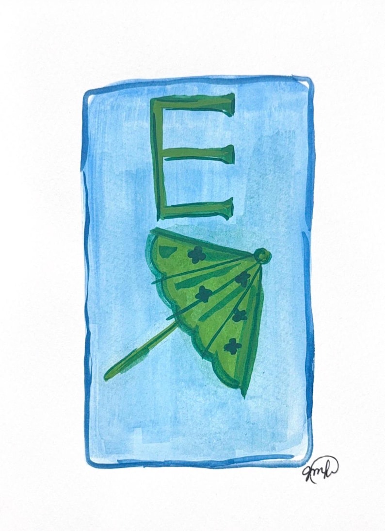 May include: Watercolor illustration of the letter "E" in green, with a green cocktail umbrella below it, set against a light blue background. The artwork has a hand-painted aesthetic, with visible brushstrokes and a signature in the bottom right corner.
