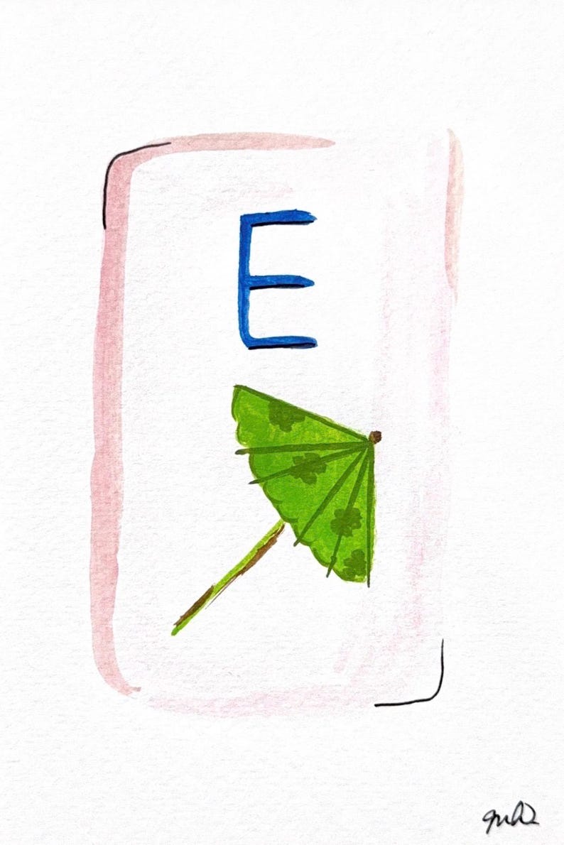 May include: Watercolor illustration featuring a blue letter "E" above a green cocktail umbrella with a floral pattern. The artwork is set within a white rectangle with a pink border and a black outline.