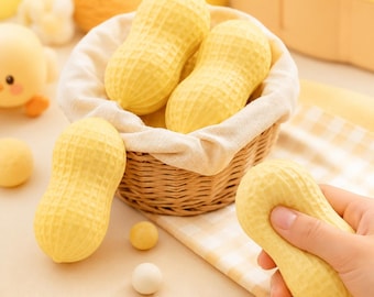 Pallina antistress morbida a forma di arachide, dalla consistenza simile al burro, giocattolo antistress realistico da spremere.