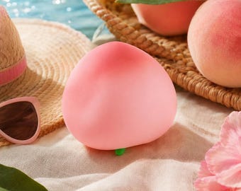 Juguete blando de melocotón rosa, juguete antiestrés de fruta de crecimiento lento, alivio sensorial con burbujas de aire