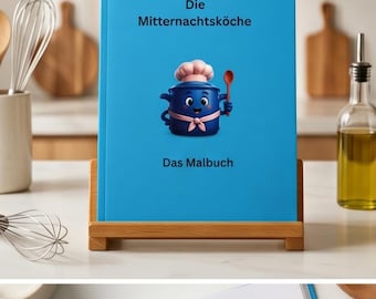 May include: A bright blue colouring book titled Die Mitternachtsköche Das Malbuch, featuring a cartoon illustration of a blue pot character wearing a pink chef hat and apron, holding a wooden spoon, displayed on a wooden stand.