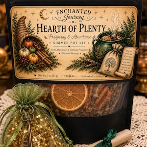 May include: A black pouch labeled Enchanted Journey Hearth of Plenty Simmer Pot Kit with a net weight of 2 oz. The kit includes a green organza bag filled with gold glitter and a metal key, plus a rolled parchment scroll tied with a green ribbon.