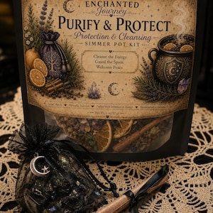 May include: A black pouch containing a simmer pot kit labeled Enchanted Journey Purify & Protect. The packaging features illustrations of citrus, herbs, and a cauldron. A small black organza bag with a moon charm and a rolled scroll are in front.