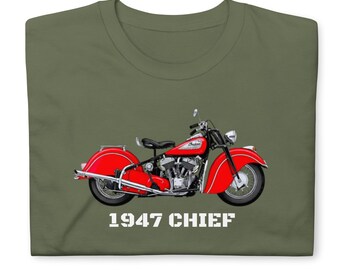 May include: An olive green t-shirt featuring a graphic of a bright red 1947 Indian Chief motorcycle in profile. The motorcycle has chrome details, a black seat, and large fenders. The text 1947 CHIEF is printed in white block letters below the motorcycle.