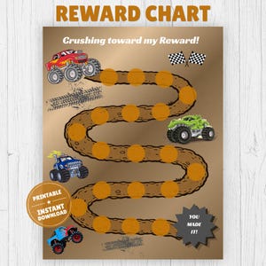 May include: A reward chart featuring the text REWARD CHART and Crushing toward my Reward! with a winding dirt track path, orange circular markers, and illustrations of four monster trucks in red, green, blue, and light blue, plus checkered flags.